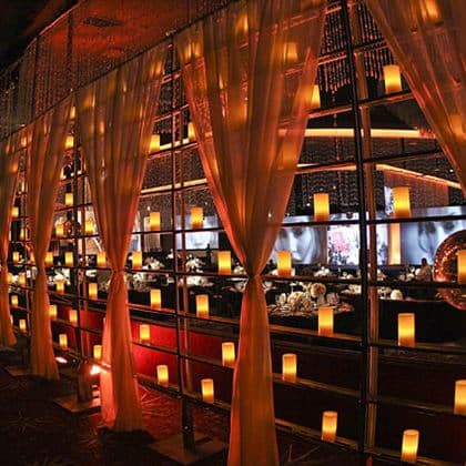 Candle Wall 5′ x 10′ – w/White Voile Drape – Gold | Rental